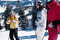 Kim Reichhelm's enthusiasm for
all things skiing is contagious, whether leading a student
through the powder or talking technique to a group on the
hill - Photo by Anne Krause